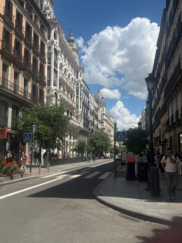 Madrid residents enjoy sunny weather in city center