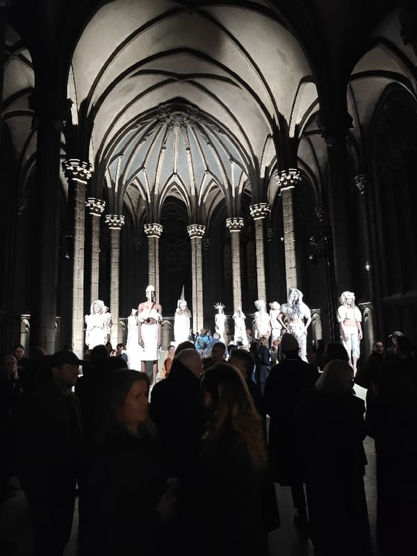 Fashion show staged in Paris gothic cathedral features white garments
