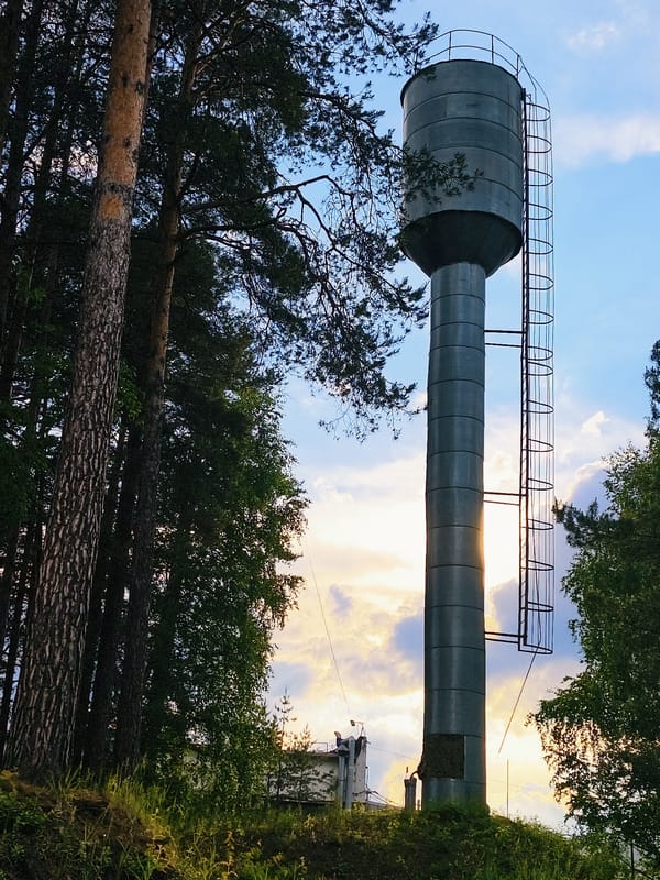 Infrastructure documented in Noviy, Russia including water tower, brick building