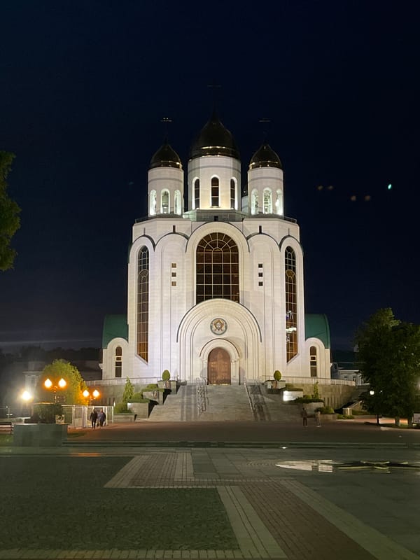 Nighttime stroll captures illuminated Kaliningrad landmarks and streetscape