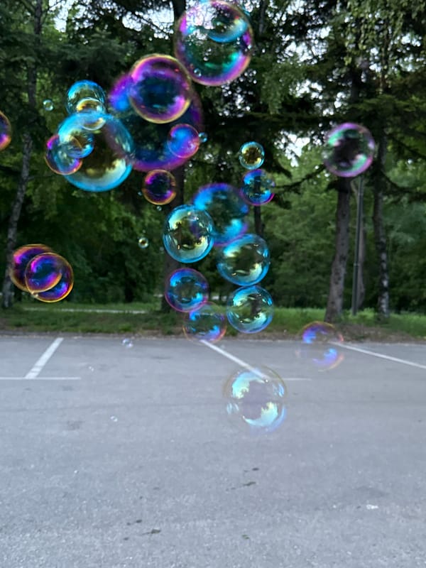 Couple makes soap bubbles in Pleven parking lot