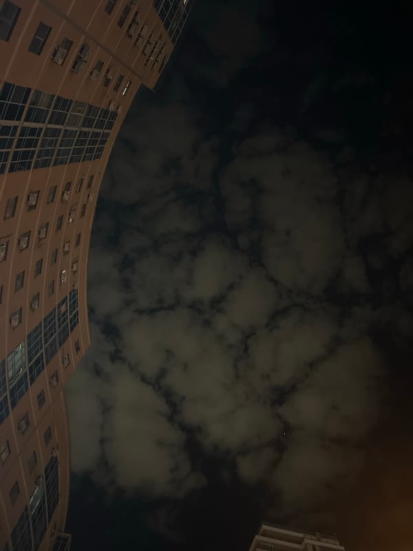 Modern curved building illuminated against night sky in Kazan