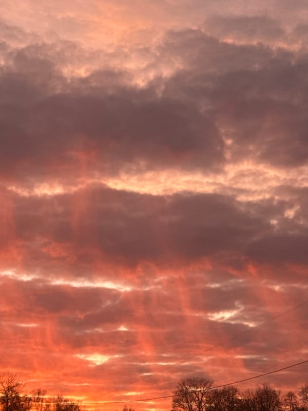Vibrant sunset paints Riga sky in dramatic colors