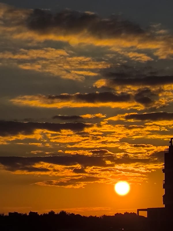 Golden sunset breaks through cloud cover over Khimki