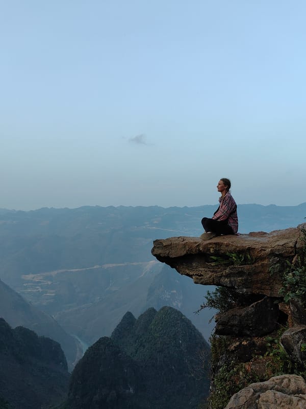 Tourists photograph mountain scenery in Đồng Văn Commune