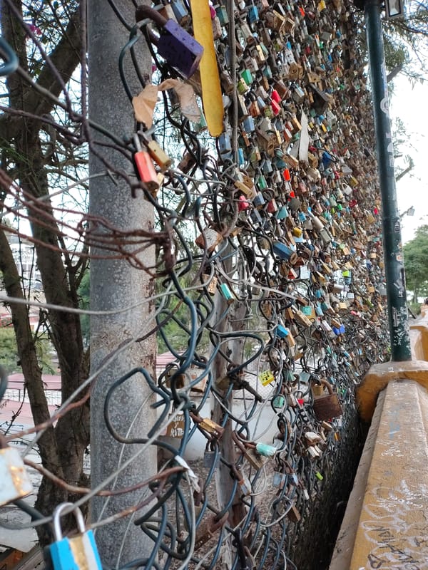 Love locks display documented on Barranco fence in Peru