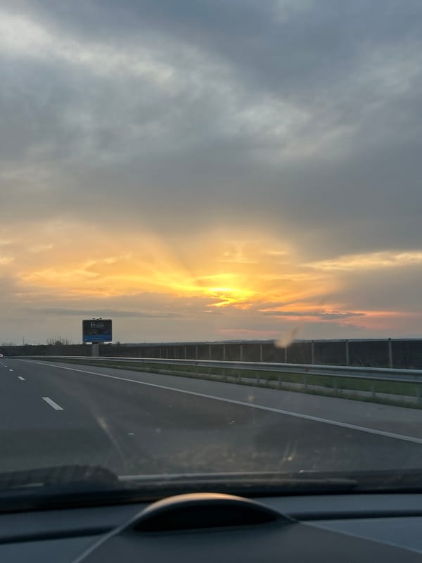 Vehicle captures sunset highway scene near Cherna Gora, Bulgaria