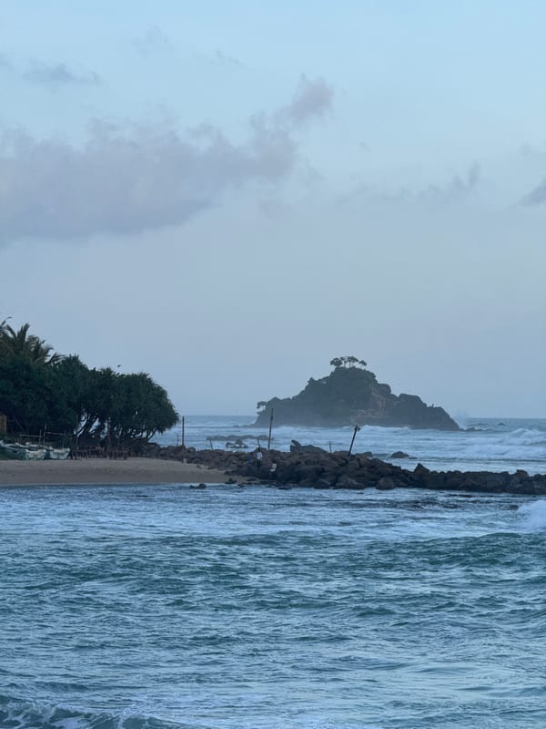 Coastal day at Goviyapana: swimming, rocks, and a beachside grill