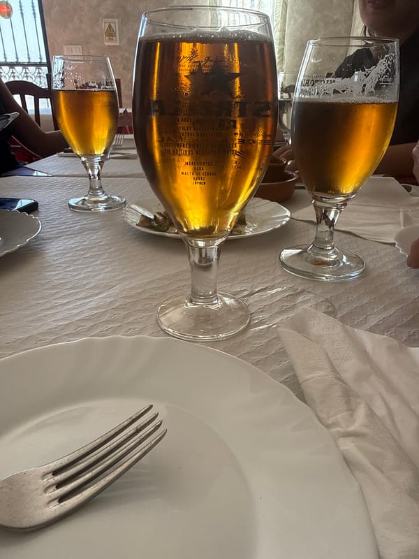 Beer glasses arranged at restaurant table in Spain