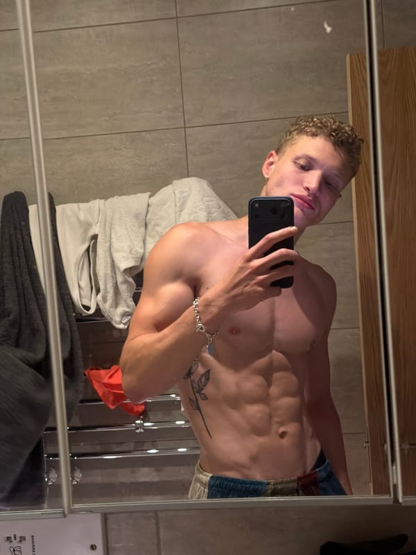 Young man takes bathroom mirror selfies in London