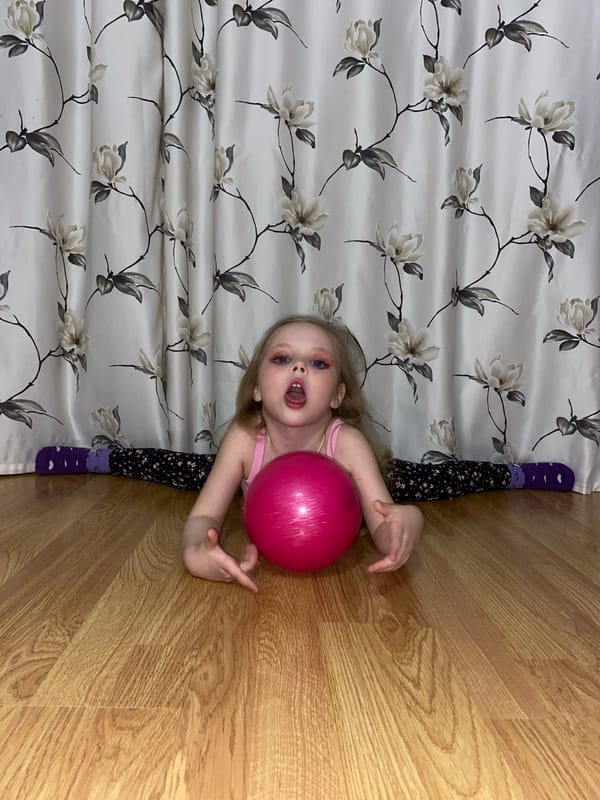 Young Girl Practices Gymnastics at Home in Votkinsk