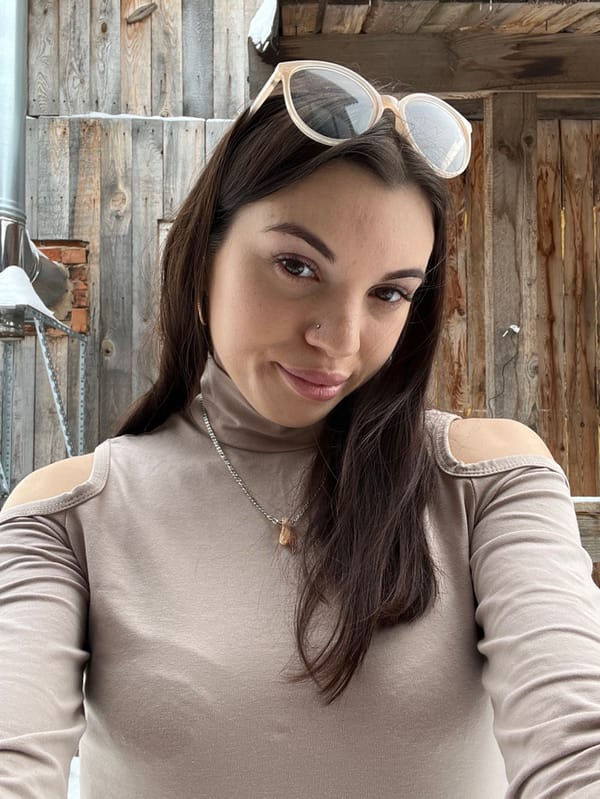Woman photographed in casual moments with pets in Chaikovsky