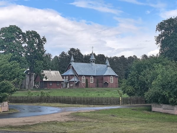 Rural Belarus church observed under dramatic afternoon cloudscape