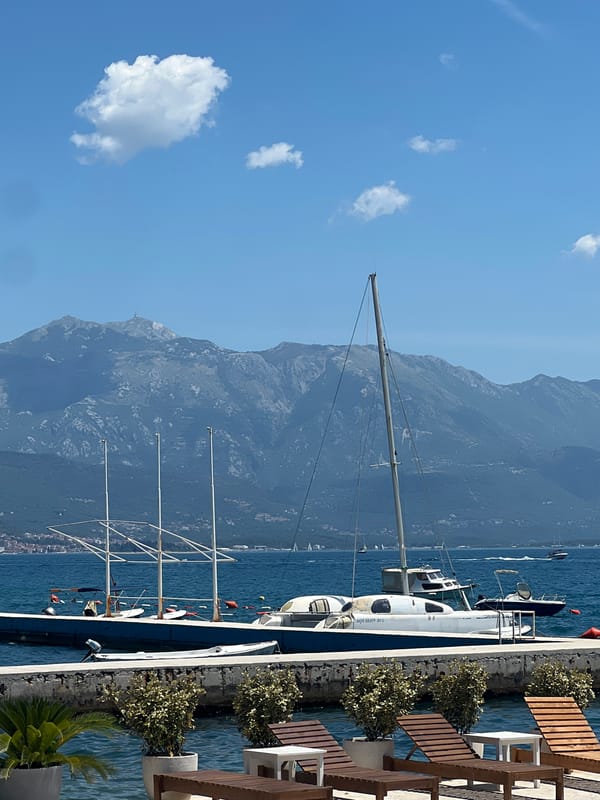 Summer beach day in full swing along Baošići's waterfront