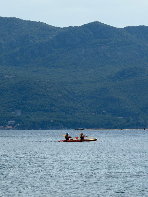 Morning beach activities observed along Budva's Adriatic coastline