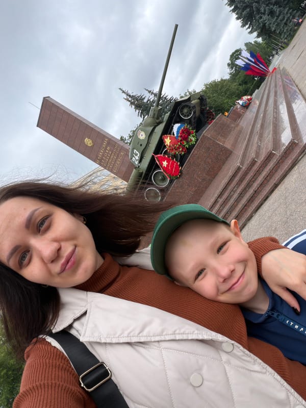 Mother and son visit war memorial, park in Perm