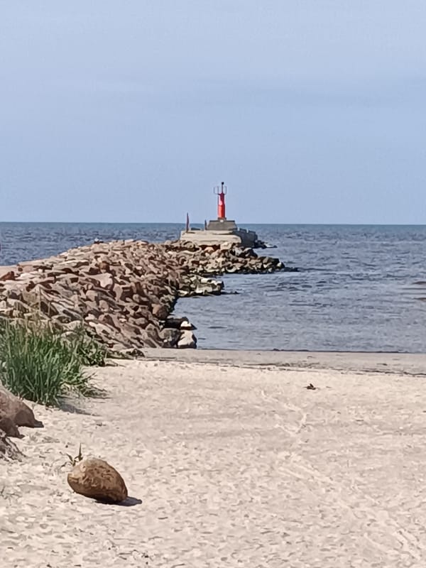 Pāvilosta harbor and coastline on a Baltic summer afternoon