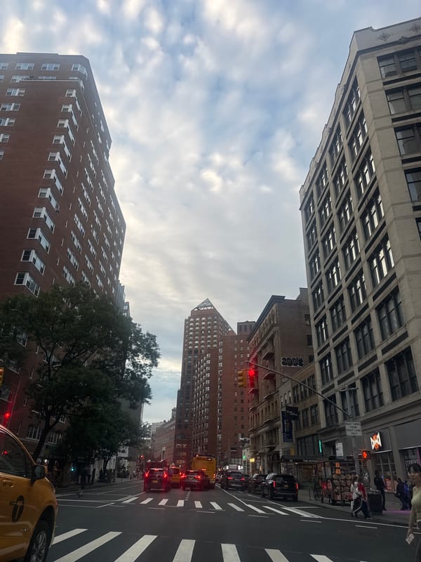 Looking up a wide New York avenue on a cloudy night