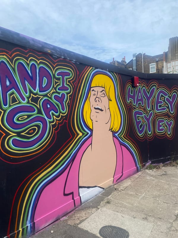 Street art with blonde figure, psychedelic text spotted in London