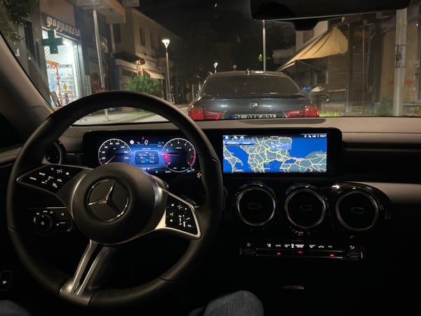 Mercedes dashboard displays navigation data during nighttime drive in Xanthi