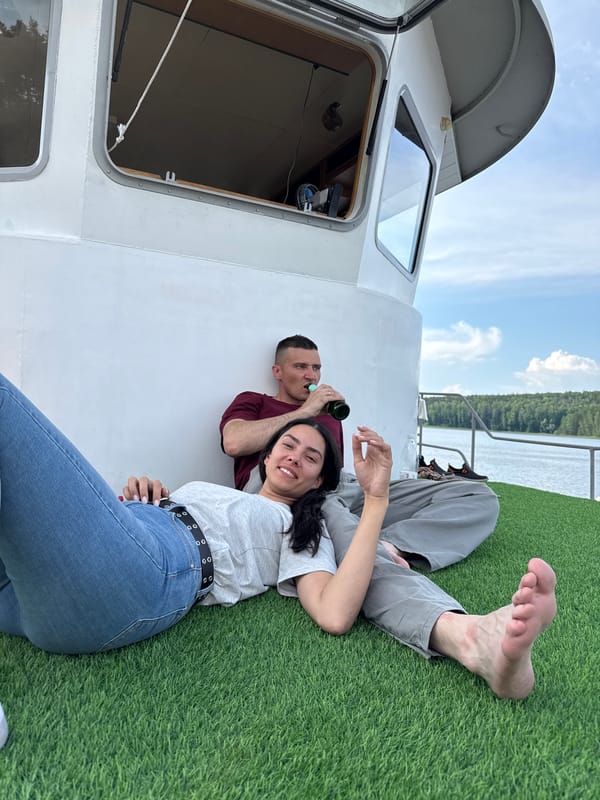 Friends enjoy leisurely boat trip and water activities in Chaykovsky