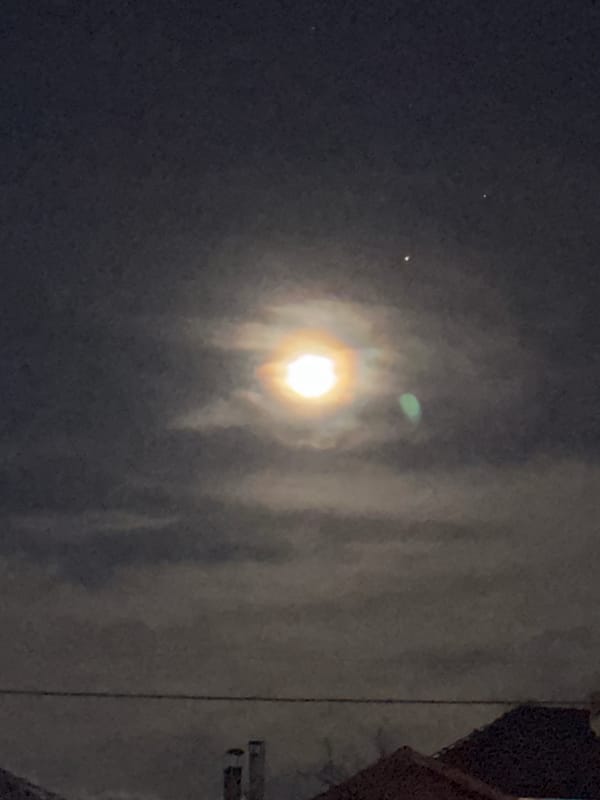 Bright light observed through cloudy night sky in Berkovitsa
