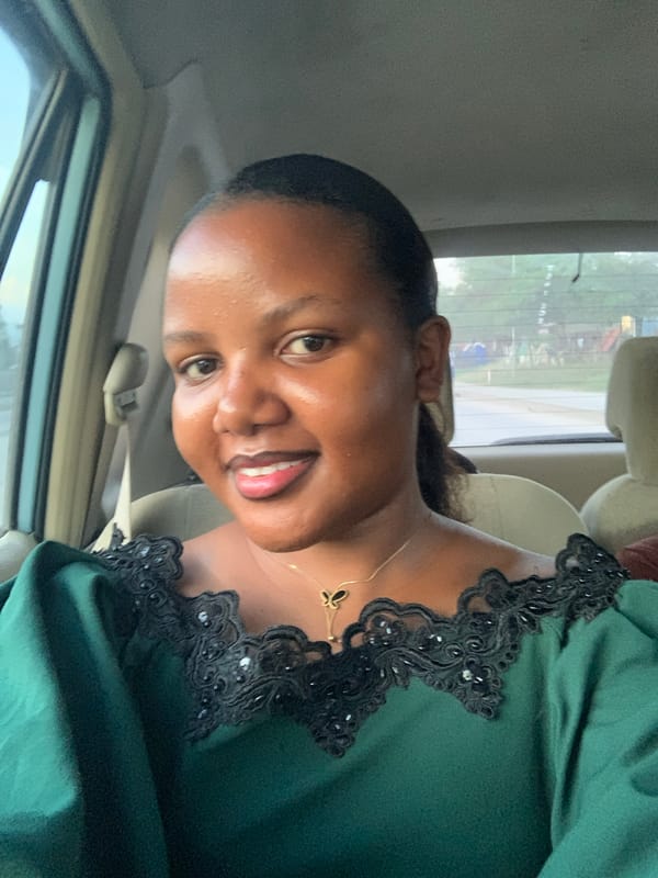 Woman in green lace top observed in vehicle in Dar es Salaam