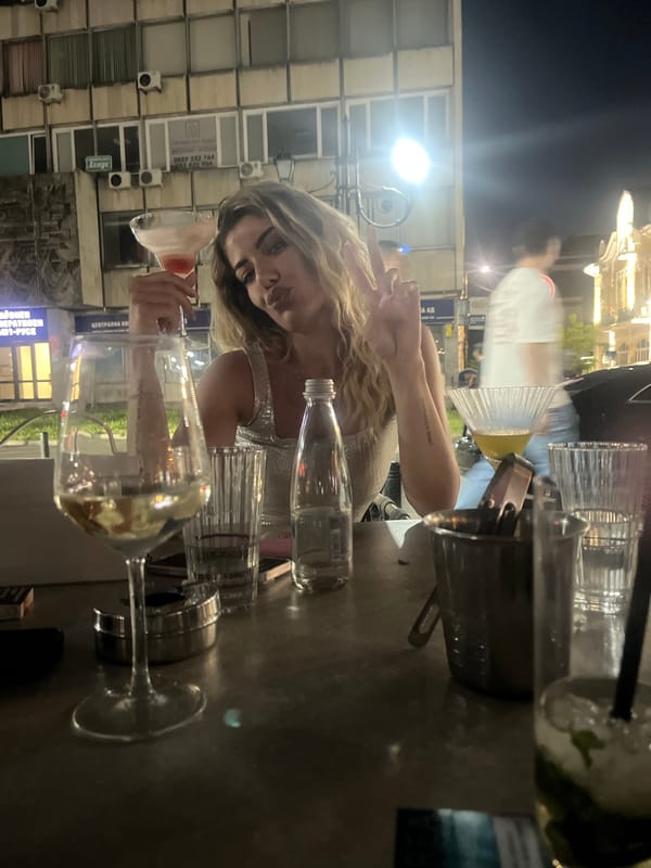 Evening drinks at an outdoor urban spot with cocktails and street art nearby