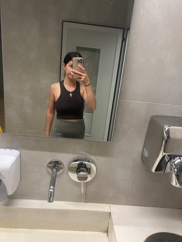 Bathroom selfie and arcade Mickey Mouse car, same moment