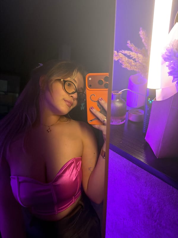 Woman takes selfies with orange phone in Russian village