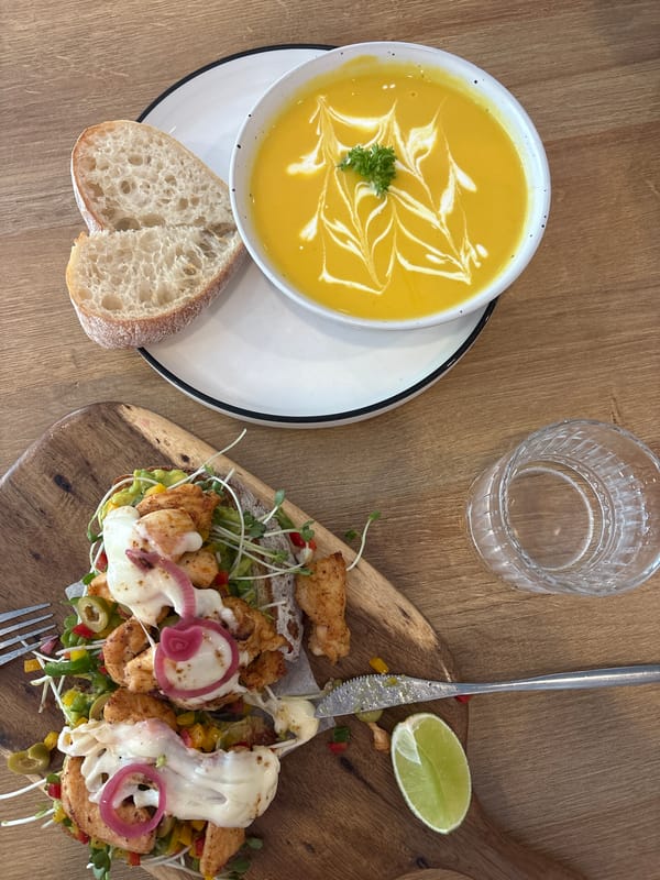 Yellow soup with garnish served in Nha Trang dining scene