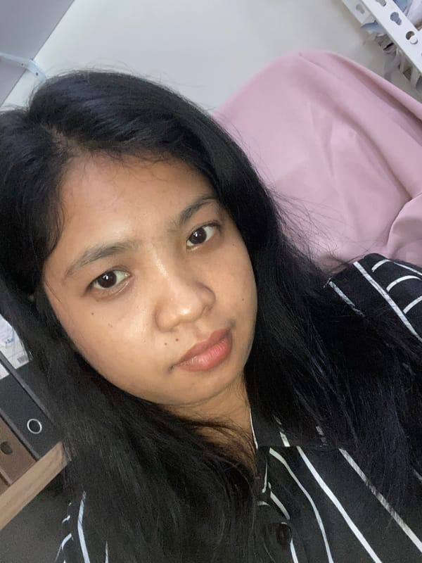 Woman photographed repeatedly indoors in Negara, Indonesia early morning