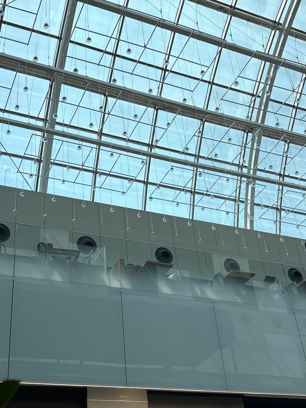 Morning exploring a modern indoor complex with retail and transit