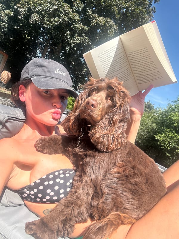 Summer afternoon reading and lounging outdoors with a dog