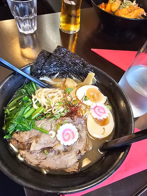 Diner documents Japanese restaurant meal in Paris evening