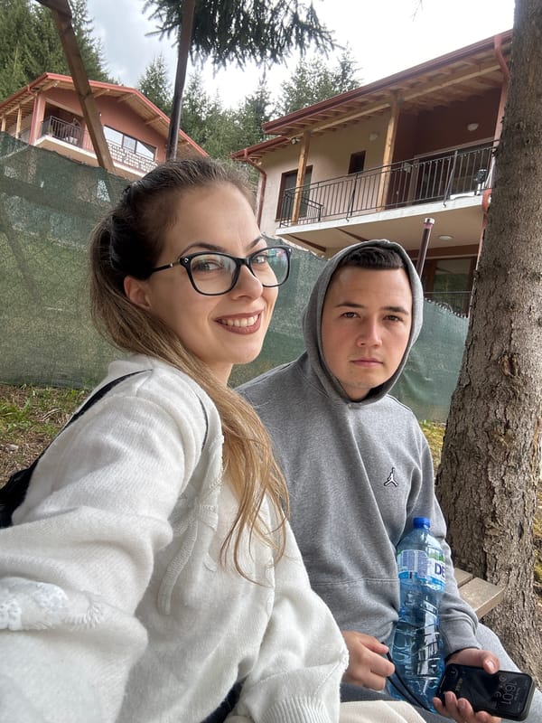 Two people relax in garden setting in Sarnitsa, Bulgaria