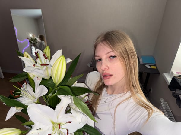 Woman takes selfies in light snow in Perm, Russia