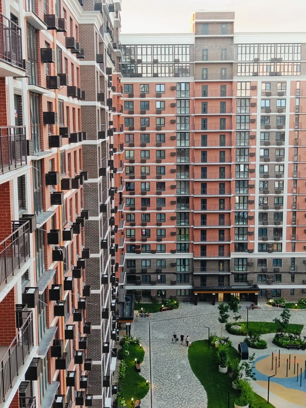 Red brick residential complex in Krasnodar, seen from multiple angles