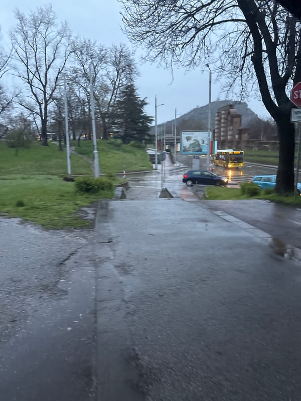 Car parked on wet street in Plovdiv after rain