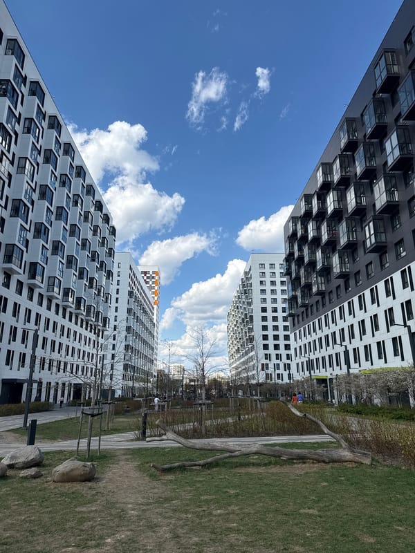Upward view captured between modern Moscow residential towers