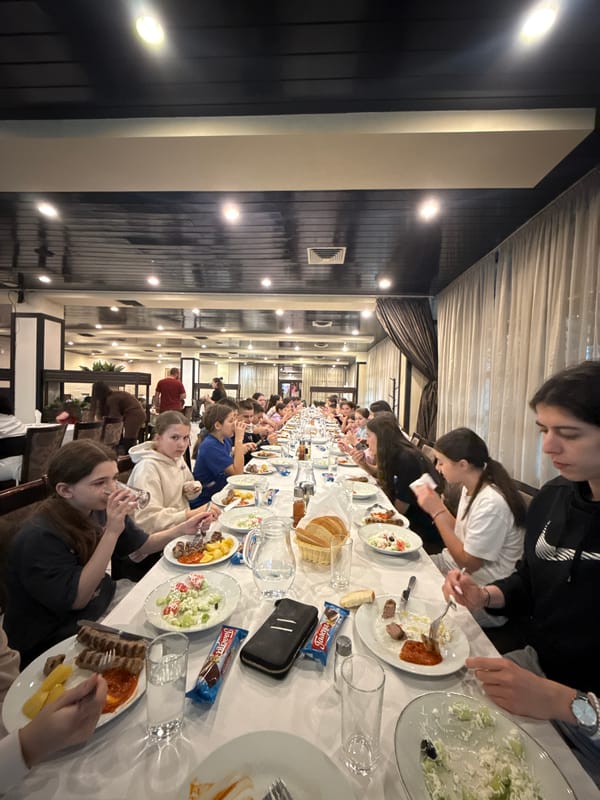 Large group shares meal at restaurant in Etropole, Bulgaria