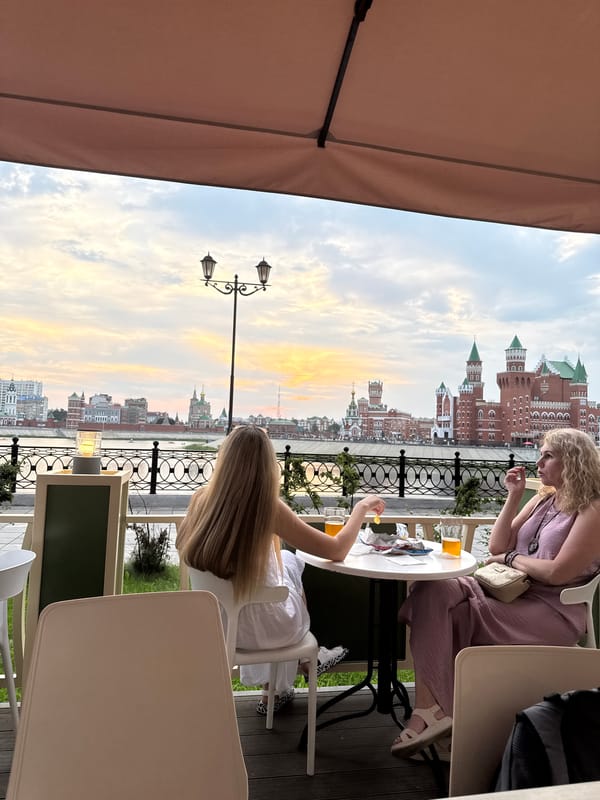Casual riverside dining along the Yoshkar-Ola embankment at dusk