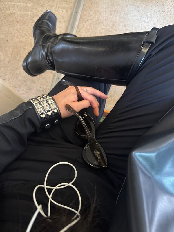 Person in black attire observed seated in London