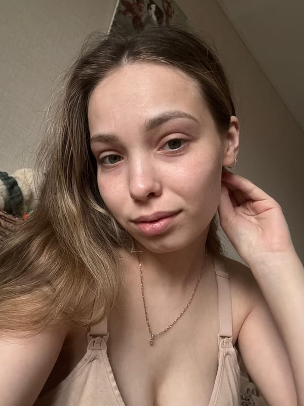 Woman and cat photographed together in Chaikovsky, Russia