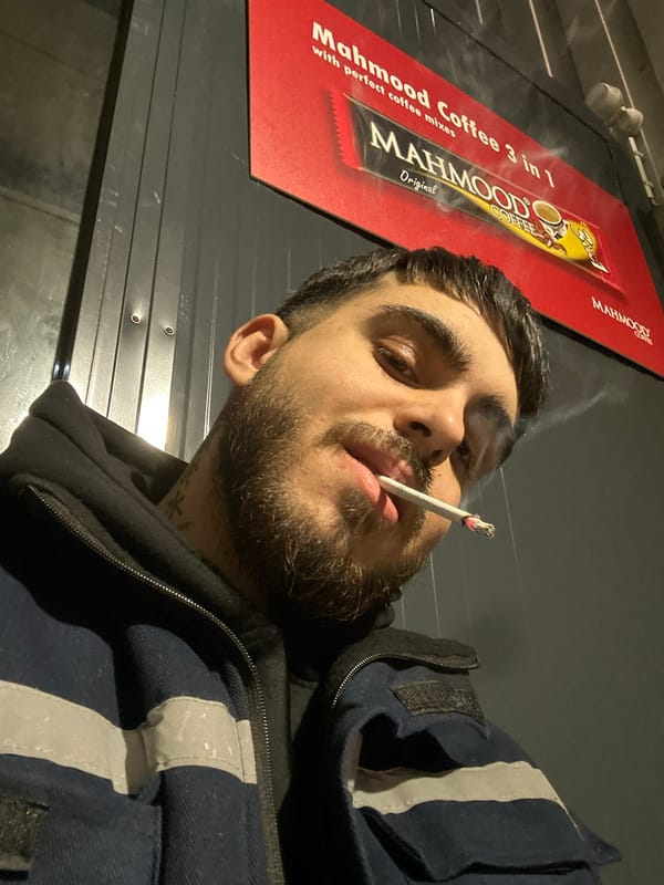 Man takes smoking selfie near coffee shop in Frankfurt