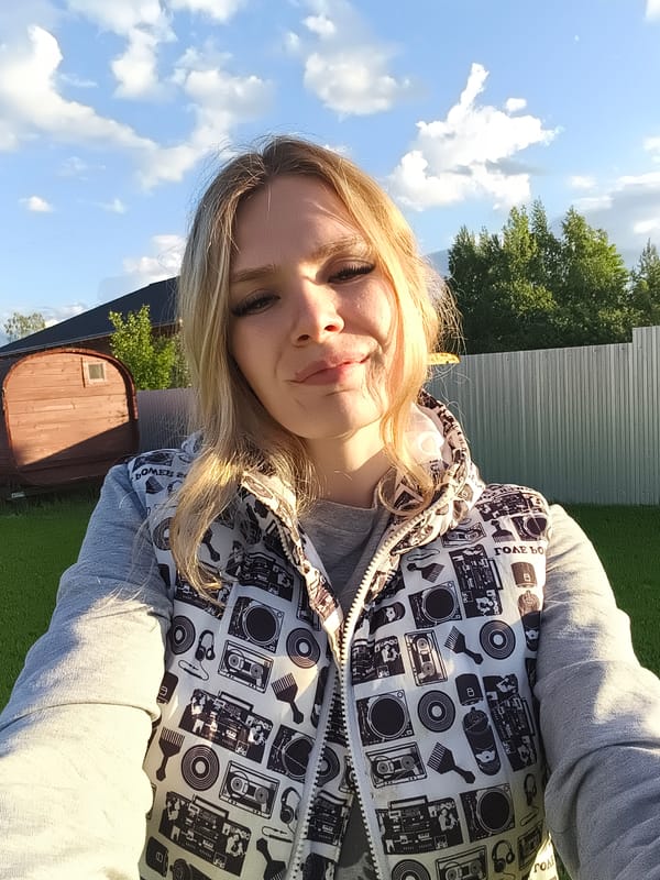 Woman takes selfies with child on sunny afternoon in Russia