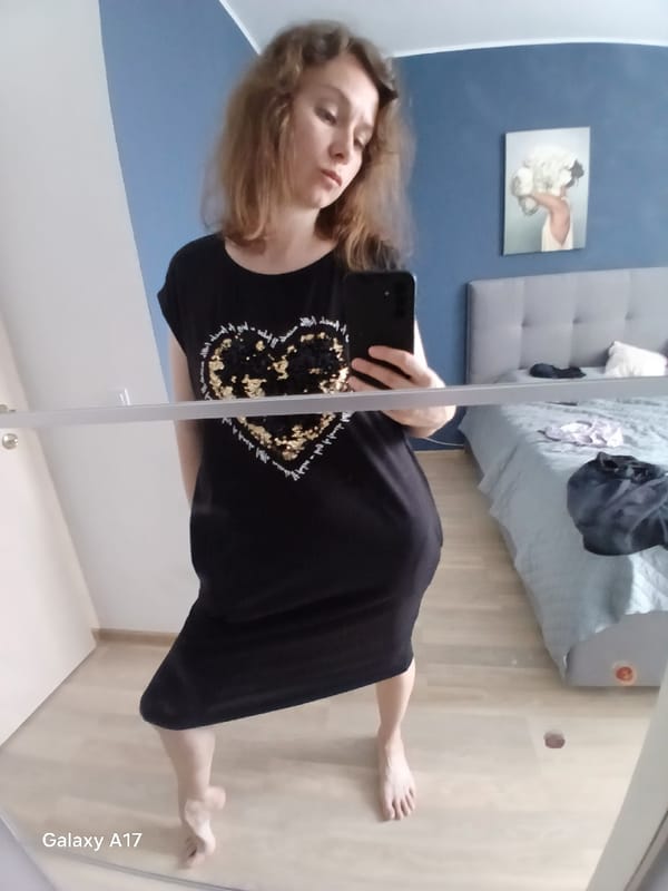 Woman takes mirror selfies in Yekaterinburg bedroom