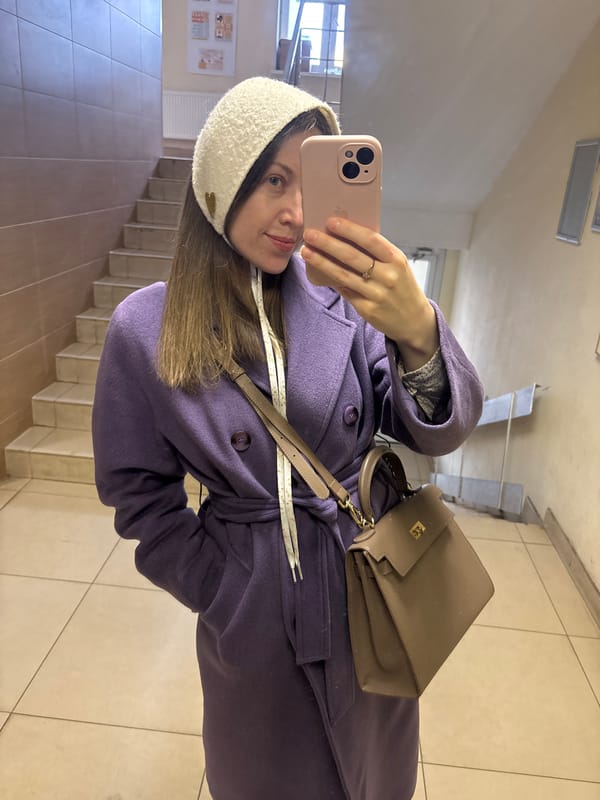 Woman takes selfie in Kudrovo stairwell