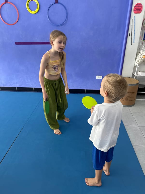 Children play ping pong in Koh Phangan facility