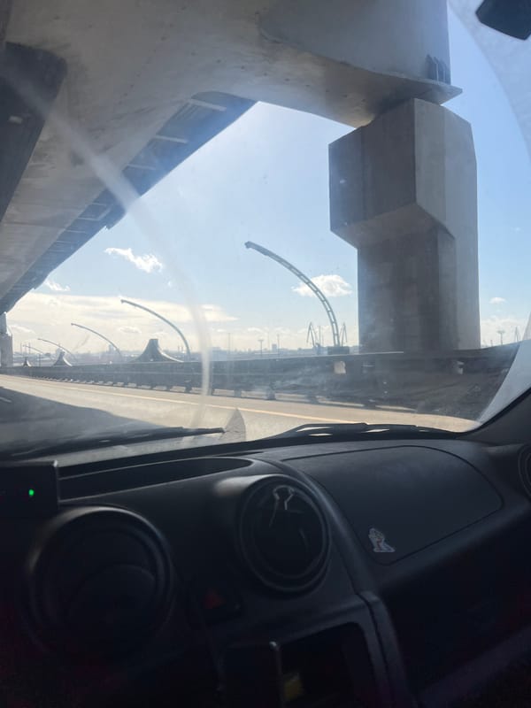Morning commute under concrete overpass in Saint Petersburg